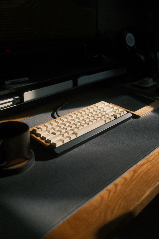 A keyboard illuminated by light from a window
