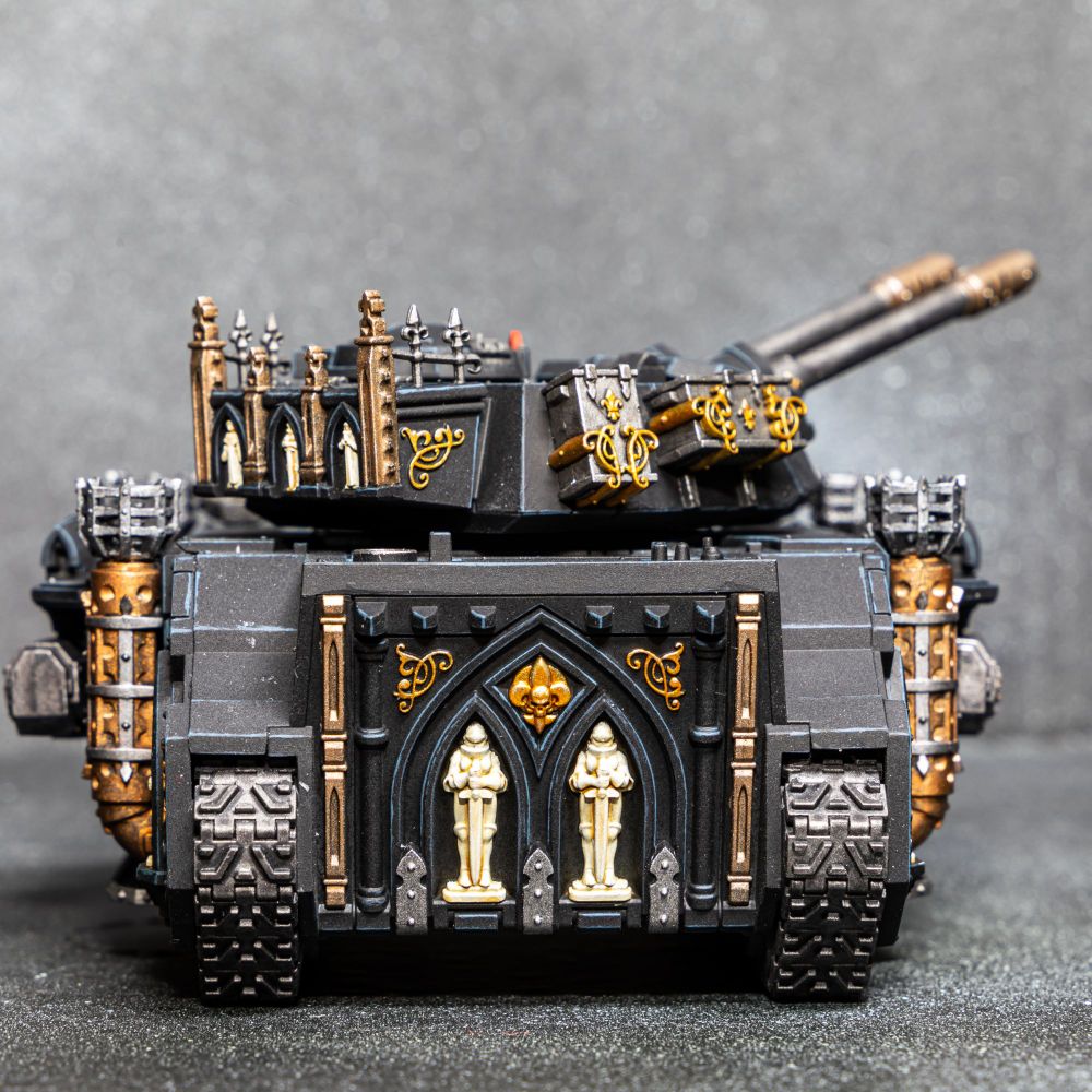 Sci-fi gothic armored tank painted in black and gold.