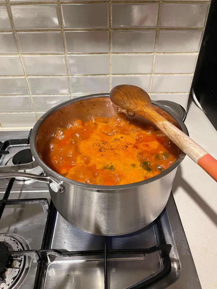 Photo of Moroccan chickpea soup bubbling in saucepan