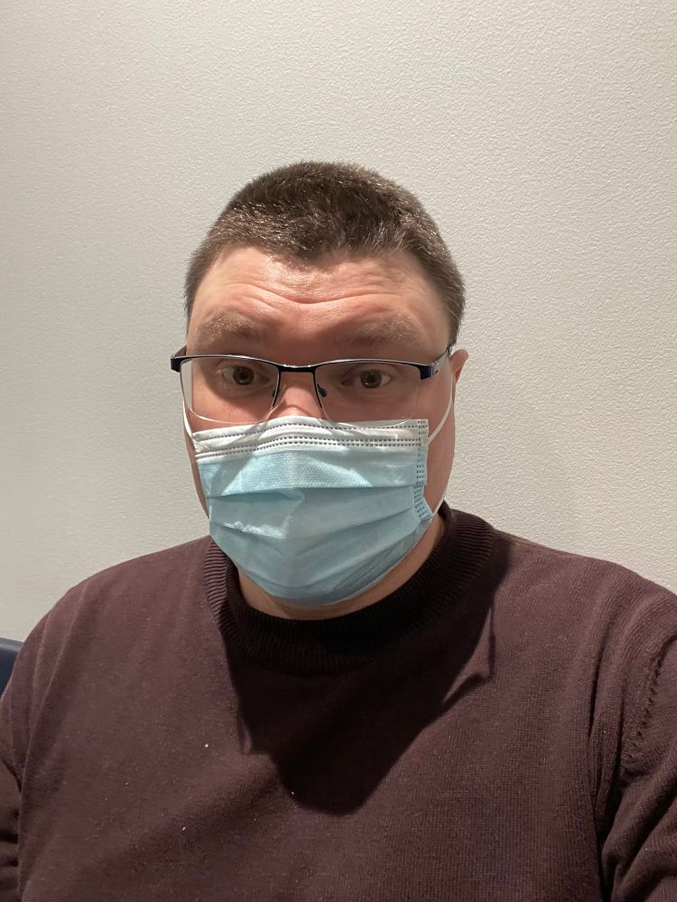 Selfie photo of me with a mask, looking miserable and feeling worse