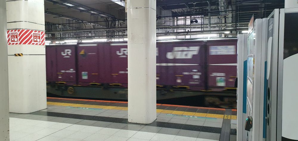 A freight train passing in Kita-senju station