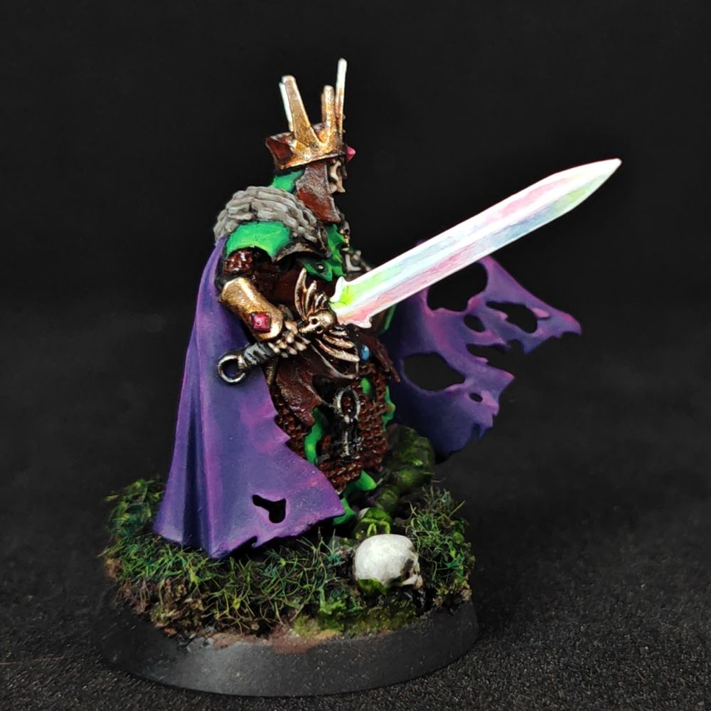 Warhammer wight lord with a rainbow sword and purple cape