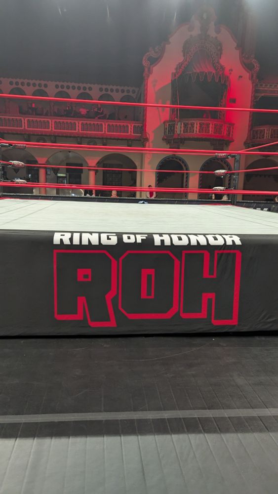 A picture of a wrestling ring in Aragon Ballroom with the apron featuring Ring of Honor's logo