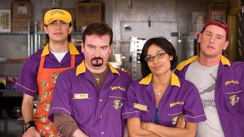 Four employees at a fast food restaurant named Moobys from the movie Clerks II.