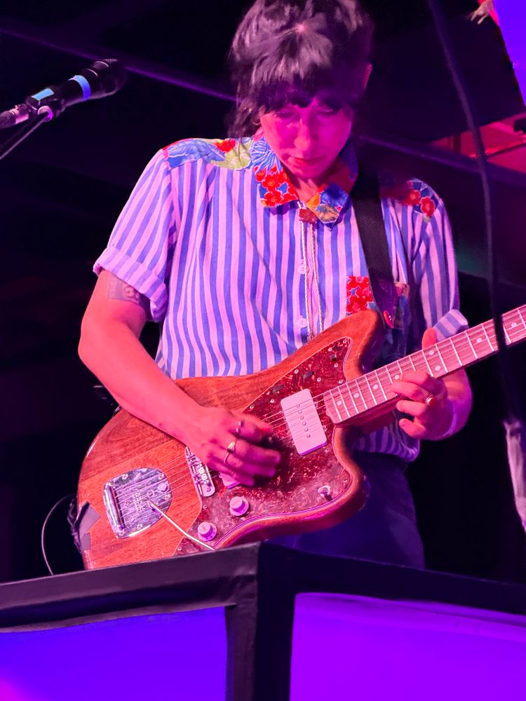 Jessica Dobson playing a guitar solo. 