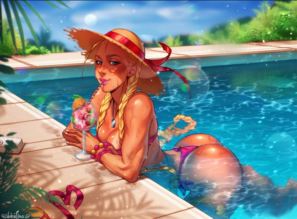 Cammy enjoying a drink by the pool