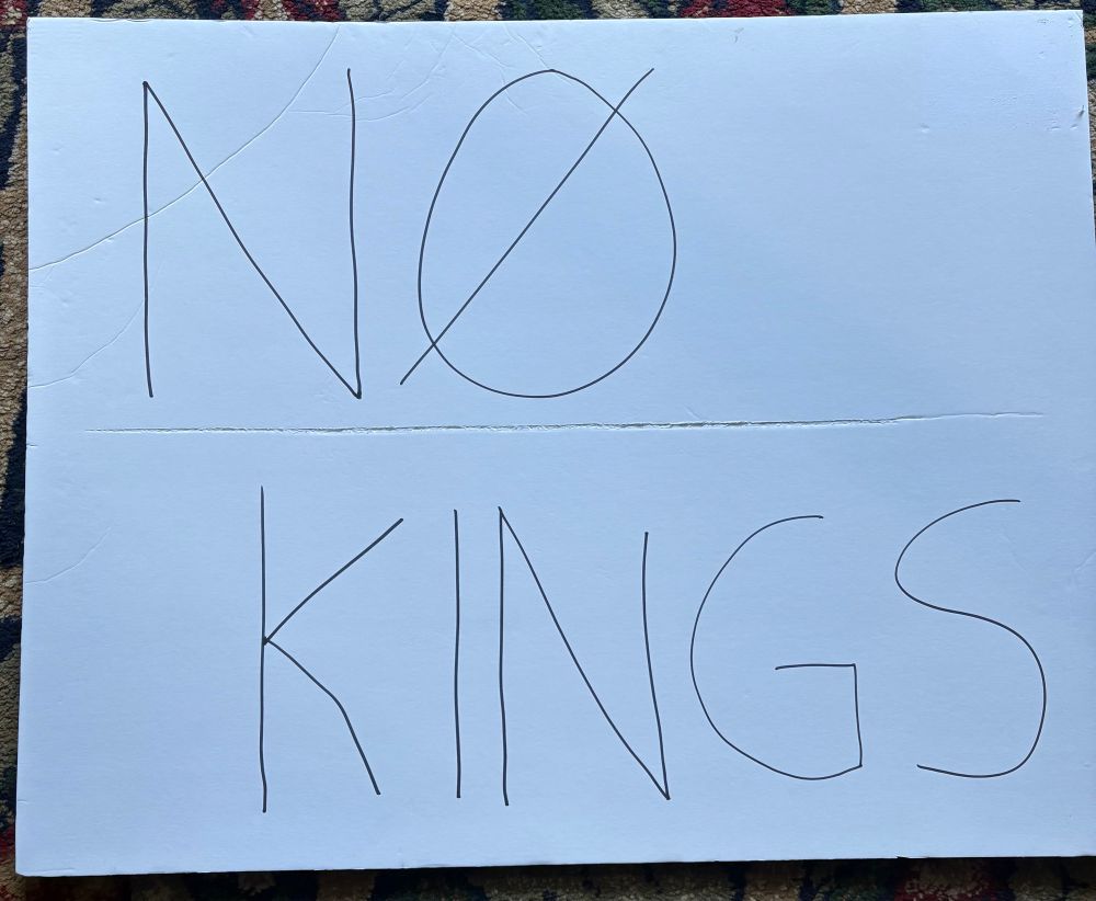 No Kings protest poster that reads “No Kings”