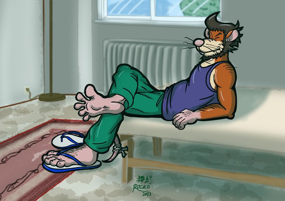 Vinh the rat lounging back on top of a mattress and bed frame