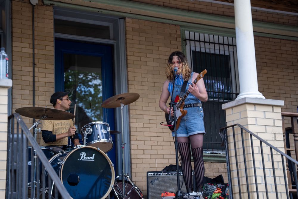 Mad dog playing drums and charlie playing a telecaster with a mustang trem and singing on a west philly porch