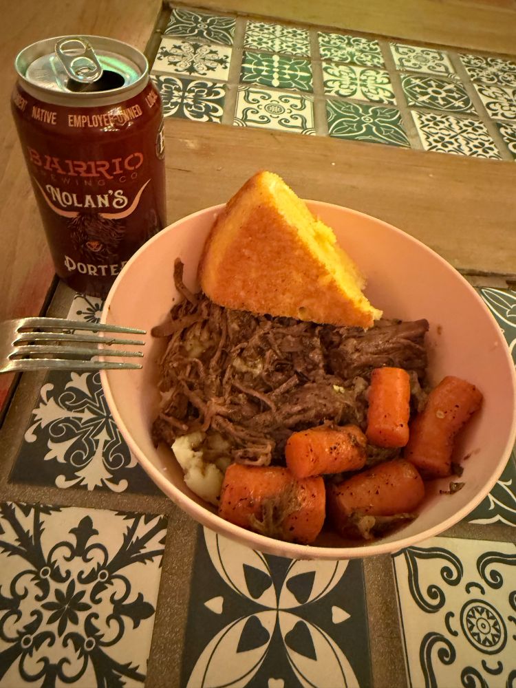 Roast and carrots over mashed potatoes, cast iron cornbread, local porter. 