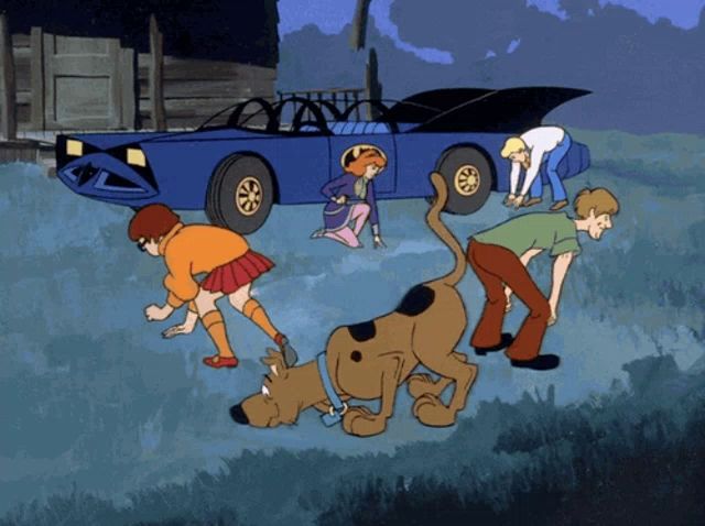 a group of scooby doo characters are gathered around a car