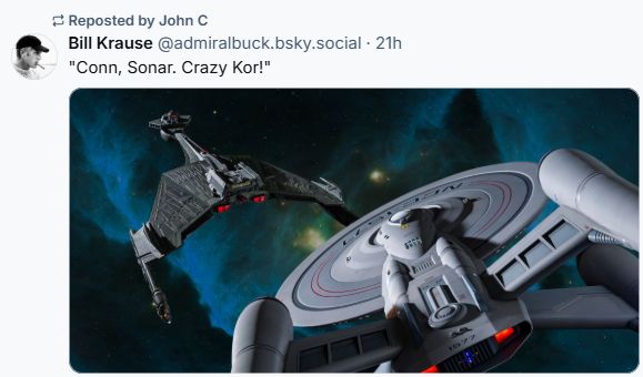 A screenshot of a Bluesky post from user "Bill Krause", reposted by user "John C". In a scene from Star Trek, a Klingon spaceship is pursued by a Federation vessel. Post text reads "Conn, Sonar. Crazy Kor!"