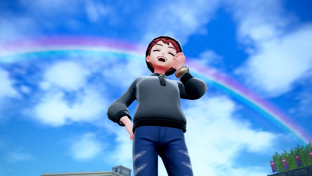 Screenshot from Pokémon Legends Z-A: Player selfie posing in front of a vast cloudy sky and a rainbow