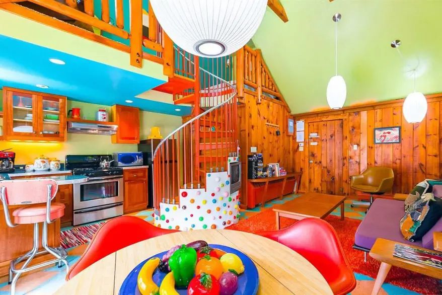 Dining table, with fruit bowl full of plastic fruit and vegetables