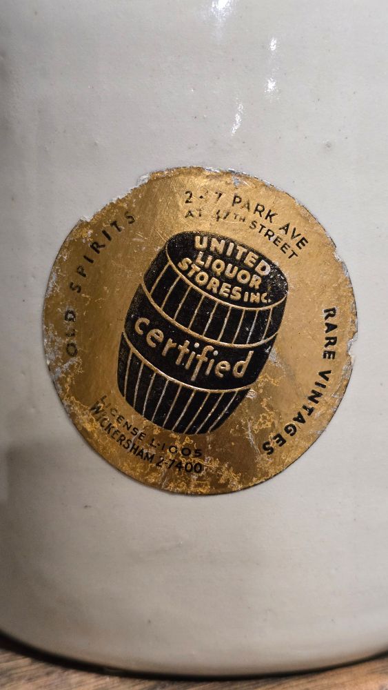 United Liquor Store inc sticker on bottle. 