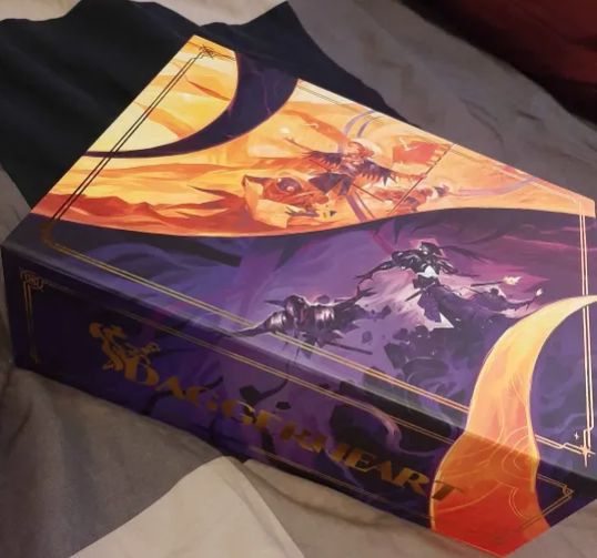 Image of my copy of Daggerheart Limited Edition laying upon a bed sheet.
