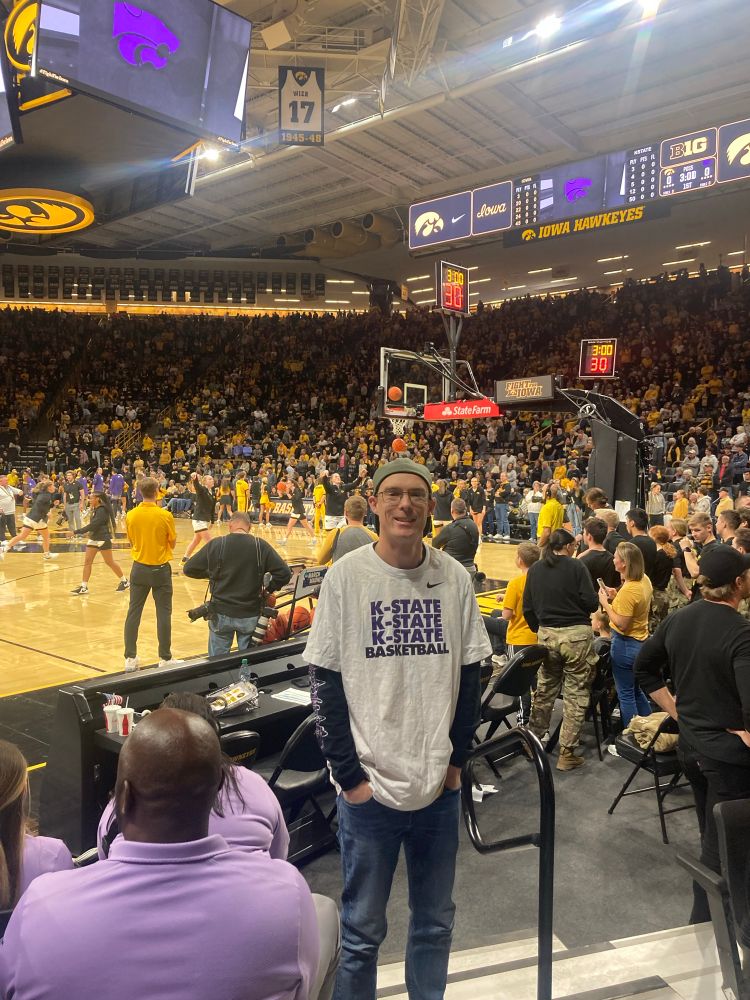 Me wearing a K-State Basketball t-shirt at Kansas State’s road game against Iowa at Carver-Hawkeye Arena in 2023.

Kansas State won.