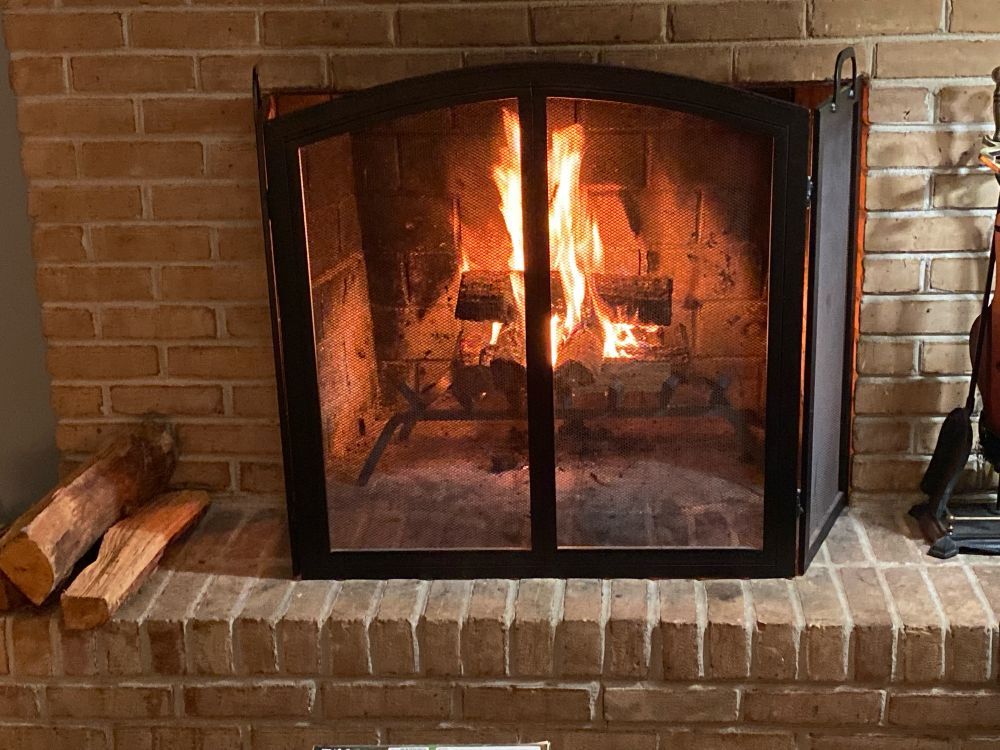 Fire in a fireplace because thank goodness we made it to Thanksgiving Break