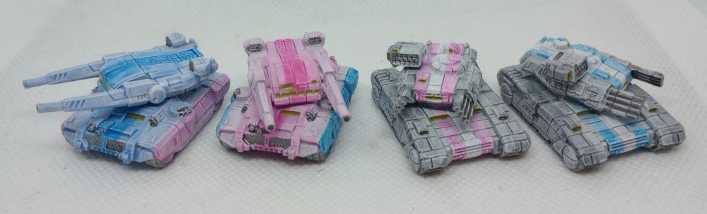 4 Sci fi tanks painted in pride flag colors for tabletop gaming 