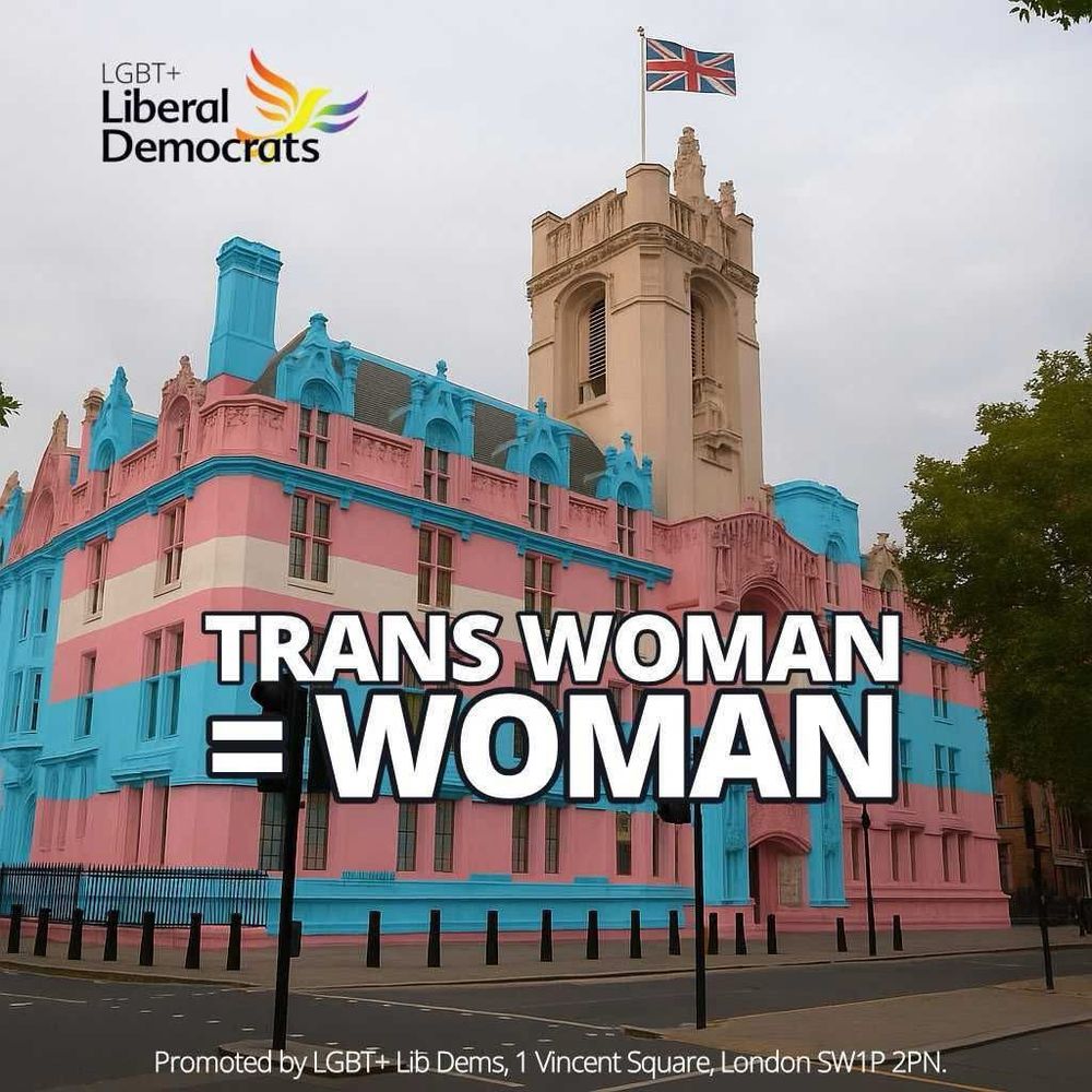 The UK Supreme Court overlaid in the colours of the trans pride flag — blue, pink and white. Overlaid bold text reads “TRANS WOMAN = WOMAN”. In the top left corner is the LGBT+ Liberal Democrats logo, and along the bottom is a small line of text: “Promoted by LGBT+ Lib Dems, 1 Vincent Square, London SW1P 2PN.”