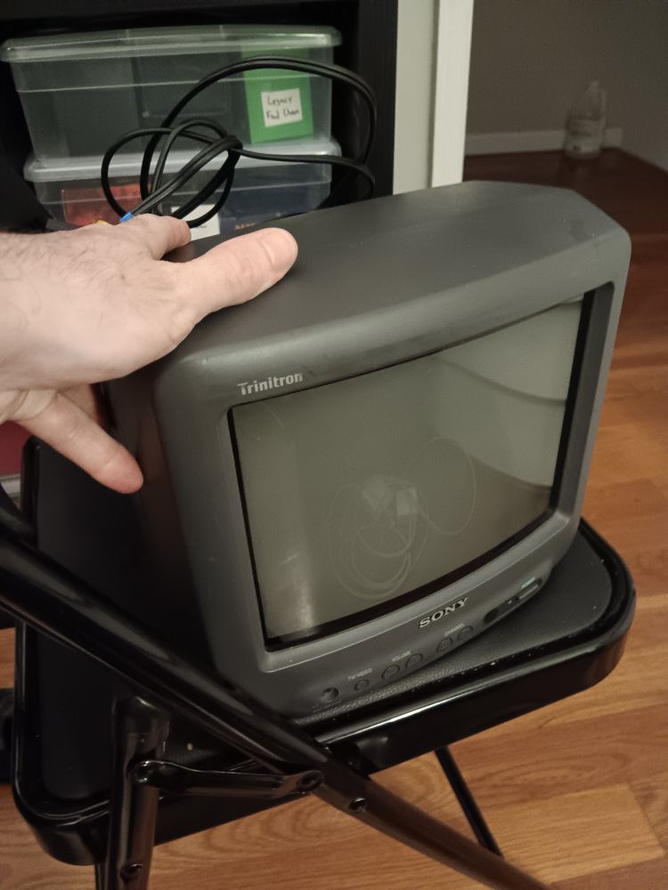a small 9" (i think) Sony Trinitron brand CRT TV. can be carried in one-hand