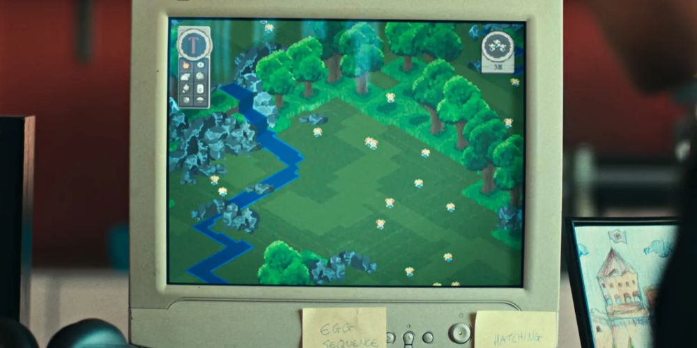 CRT computer monitor showing an isometric game where you take care of little yellow creatures in a forest