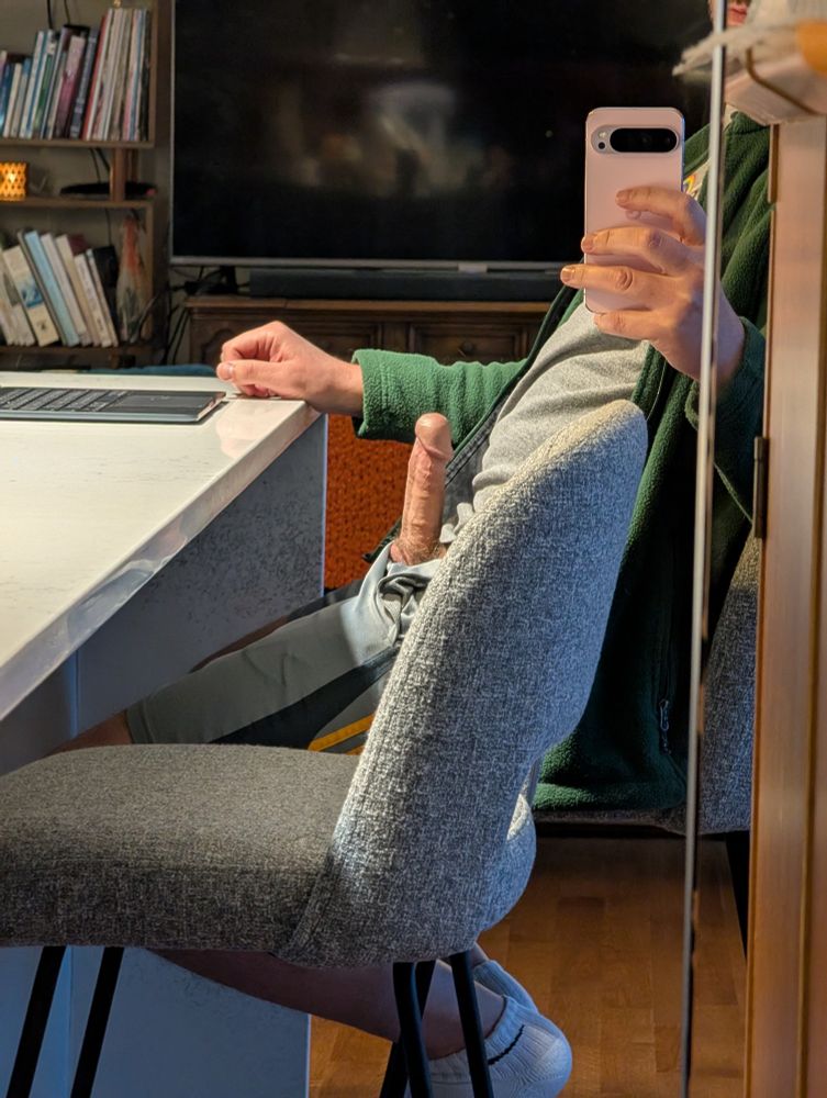 Sitting in a chair with my hard dick poking out