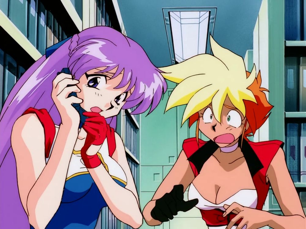 Yuri is on the phone. Kei looks dismayed.