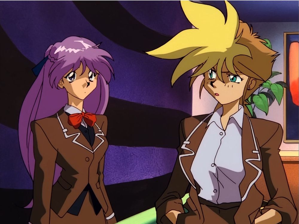 Yuri, properly dressed, staring at Kei, improperly delinquent.