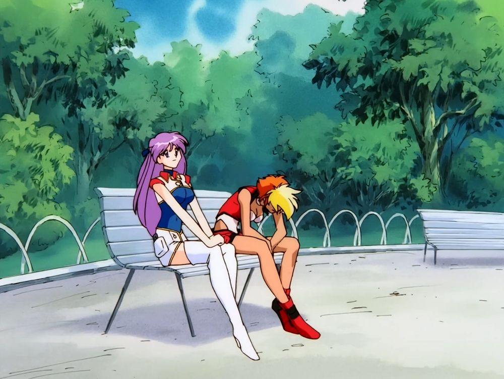 Yuri and Kei sitting on a park bench