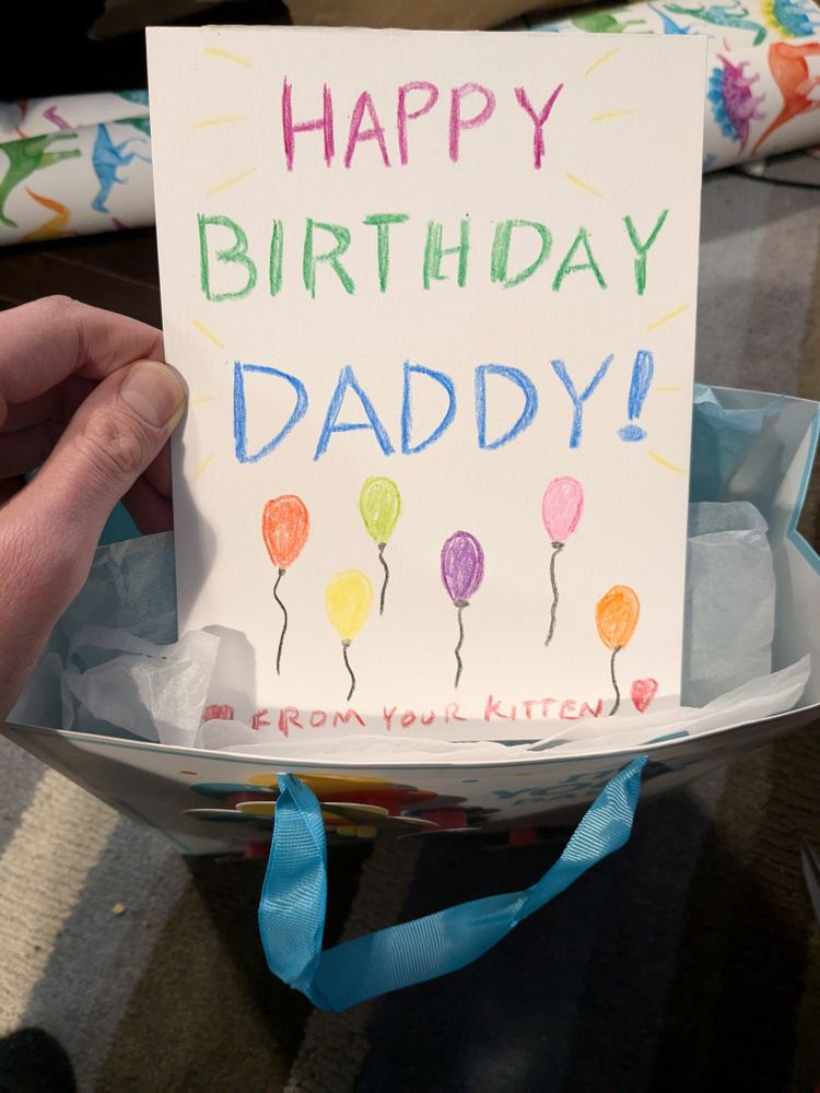A card I made for my Daddy's birthday! I wrote "Happy Birthday Daddy!" in crayon and I drew some balloons on it in different colours.