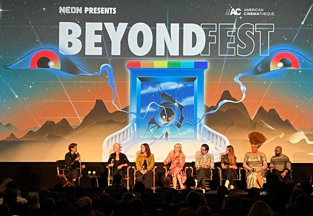 The filmmakers, cast, and crew of Queens of the Dead on stage doing a Q&A. 
