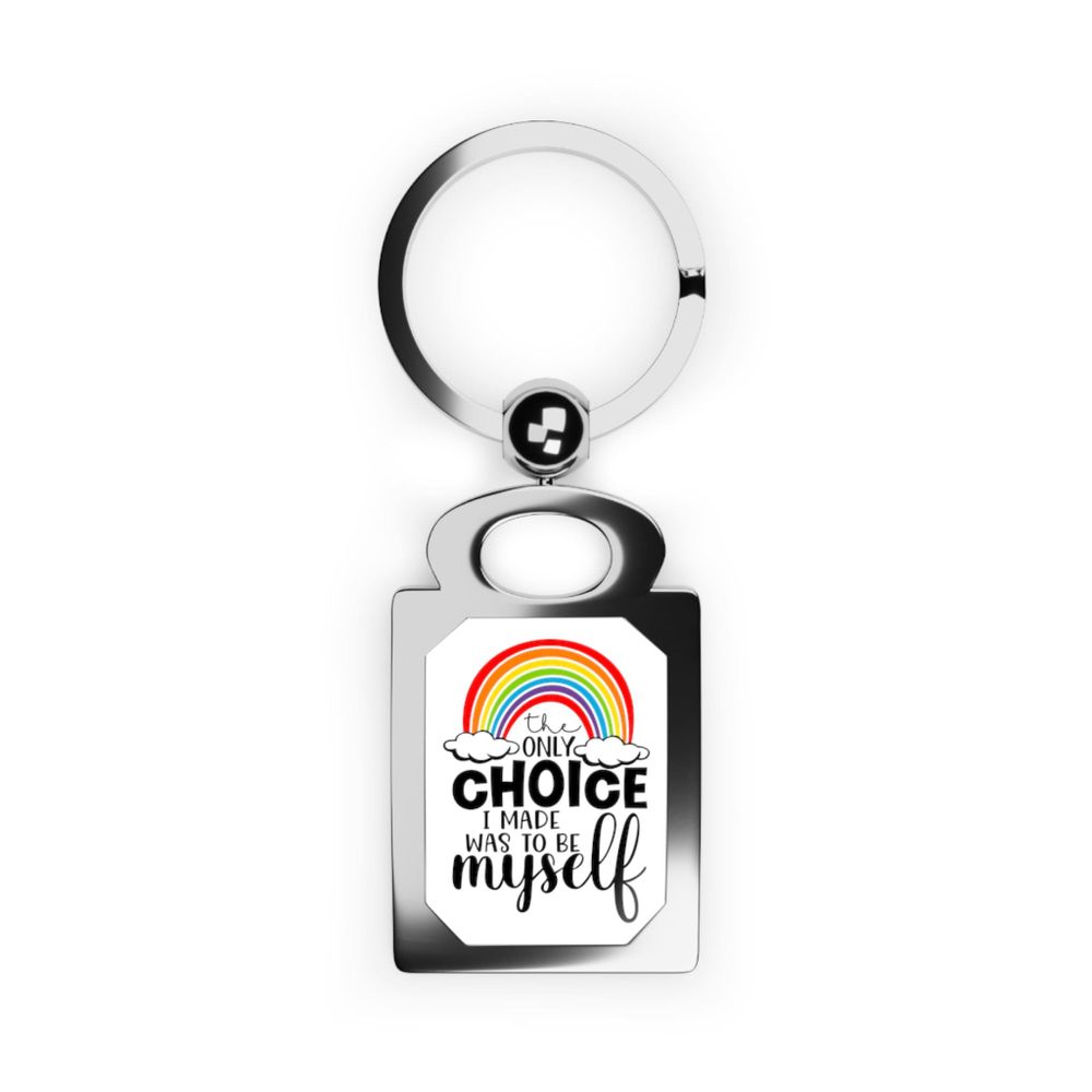 **ALT Description:**
A keychain featuring a vibrant rainbow design above the phrase "the only choice I made was to be myself." The keychain has a sturdy metal ring and a reflective surface that enhances the colorful design. The overall look is empowering and symbolizes pride and authenticity.https://stingscustom.etsy.com/listing/1673792507