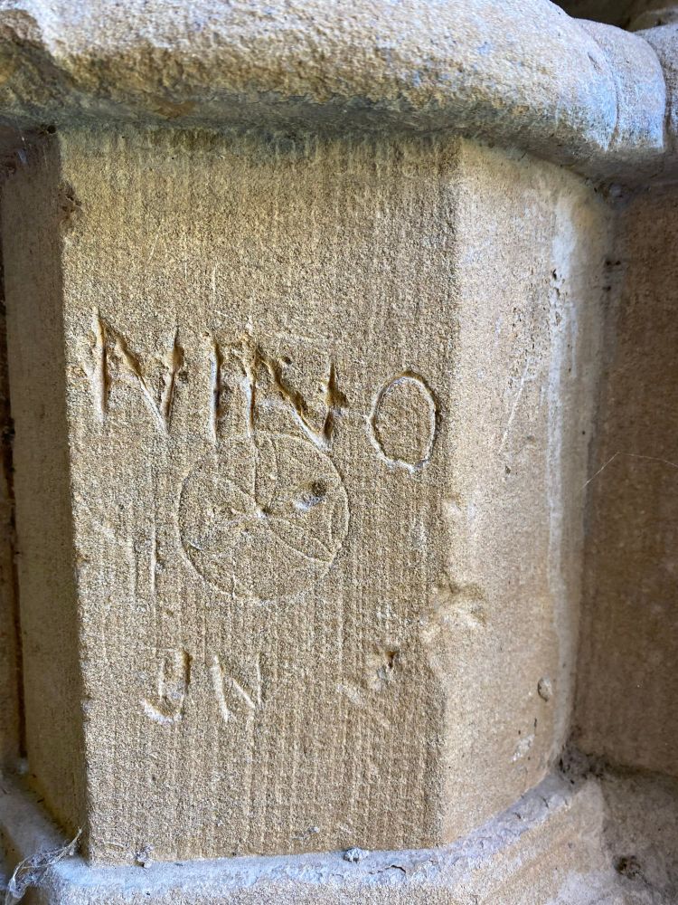 Graffiti carved on a stone column at Pamplona Cathedral 