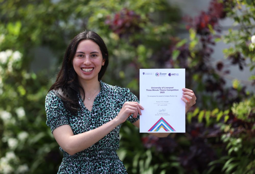 Rukun Khalaf with the runner's up certificate for the University of Liverpool’s Three Minute Thesis Competition.
