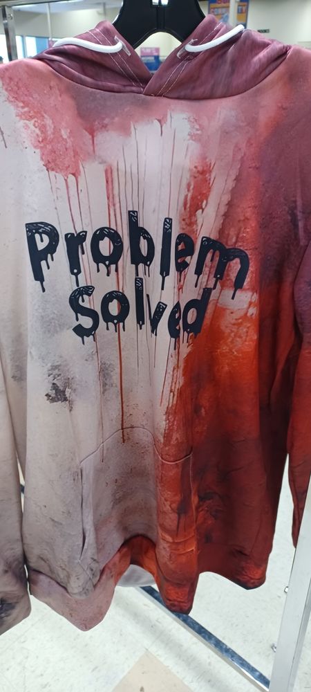 bloody shirt that says PROBLEM SOLVED in blood letters