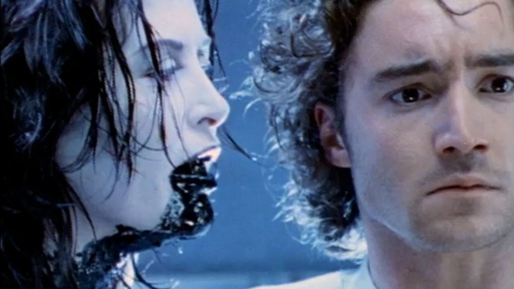 jennifer ward-lealand and paolo rotondo have a quiet moment in THE UGLY 1997