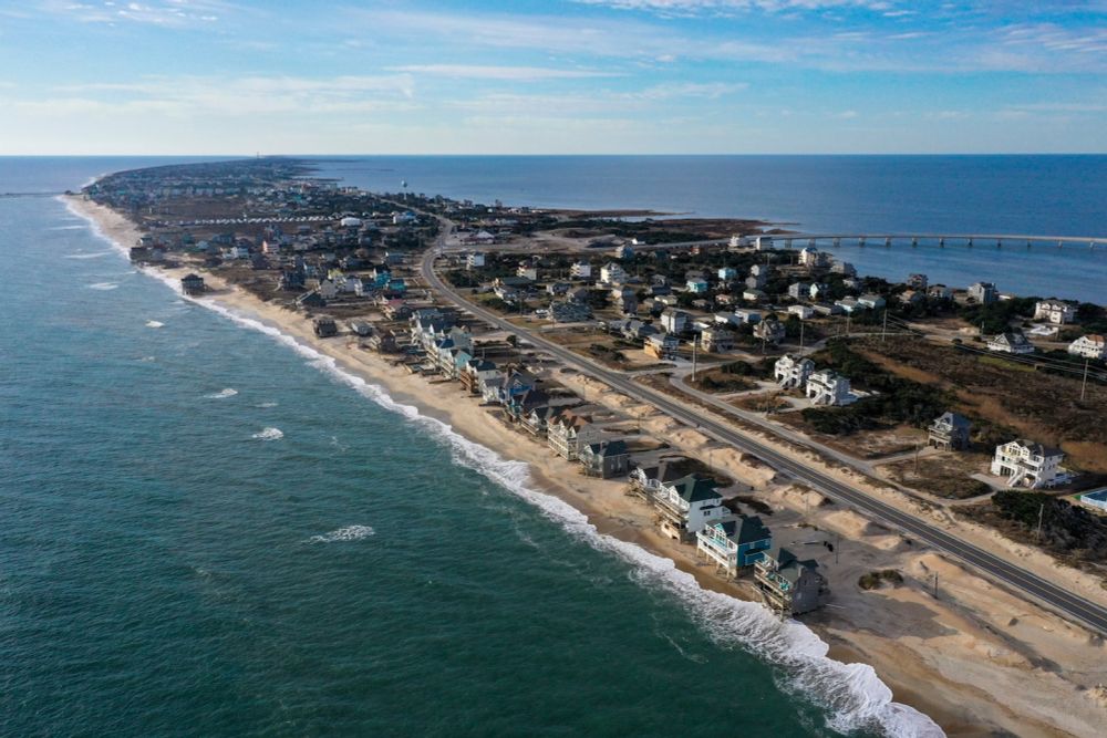 These houses are at risk of falling into the sea. The U.S. government bought them.