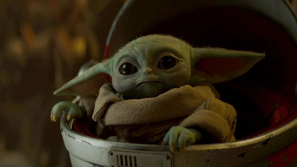 Baby Yoda making a holding-back-tears-while-looking-cute face. 