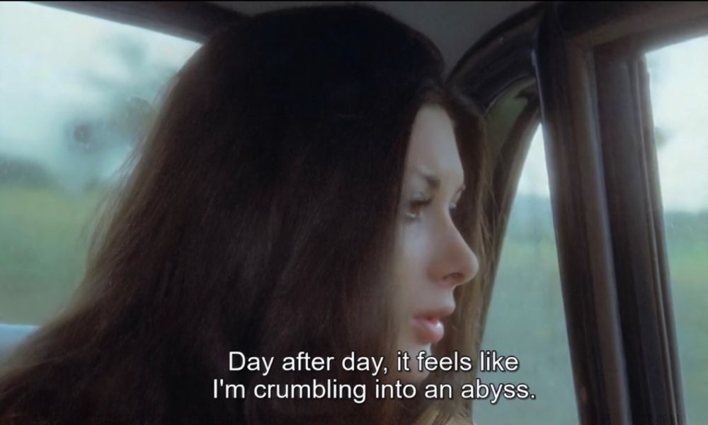 A still with subtitles from the 1972 Italian giallo film All the Colors of the Dark, starring Edwige Fenech. 