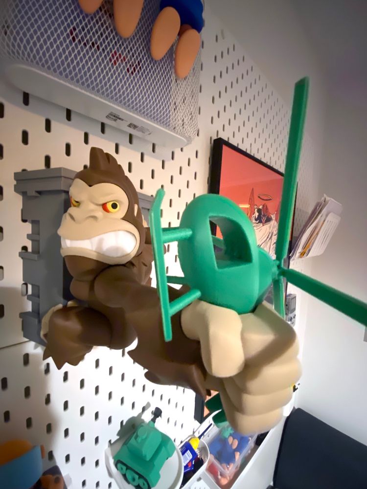 3d printed George from the game rampage clings to a wall