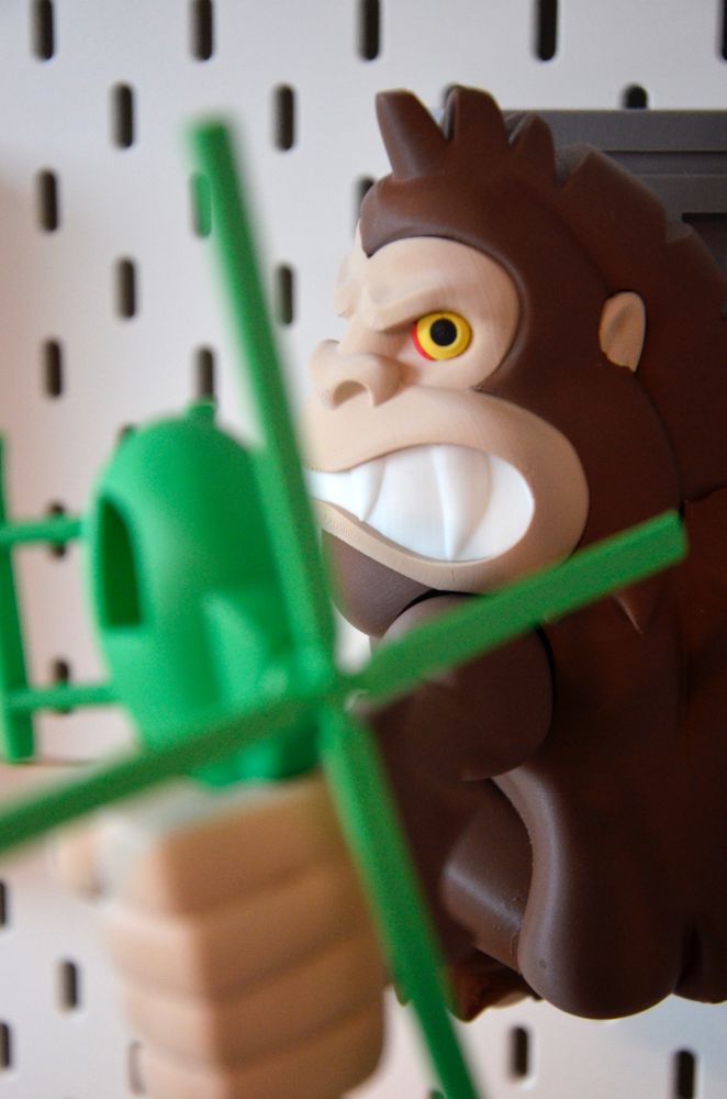 3d printed George from the game rampage clings to a wall