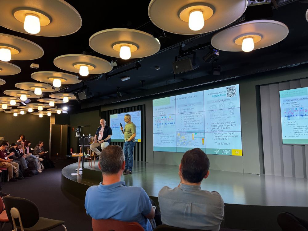 Nick presenting to a crowded room at BioHackathon