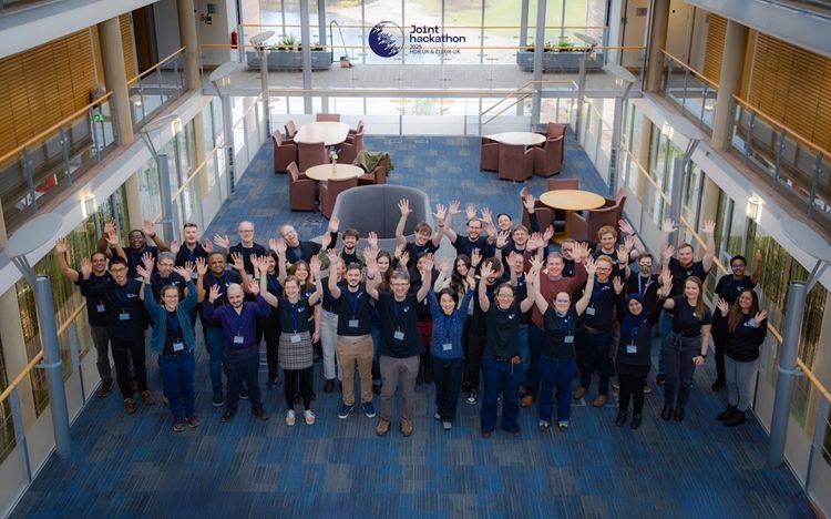 Group photograph, everyone raising their arms