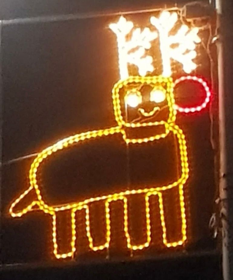 Child’s drawing of a reindeer in Christmas lights 