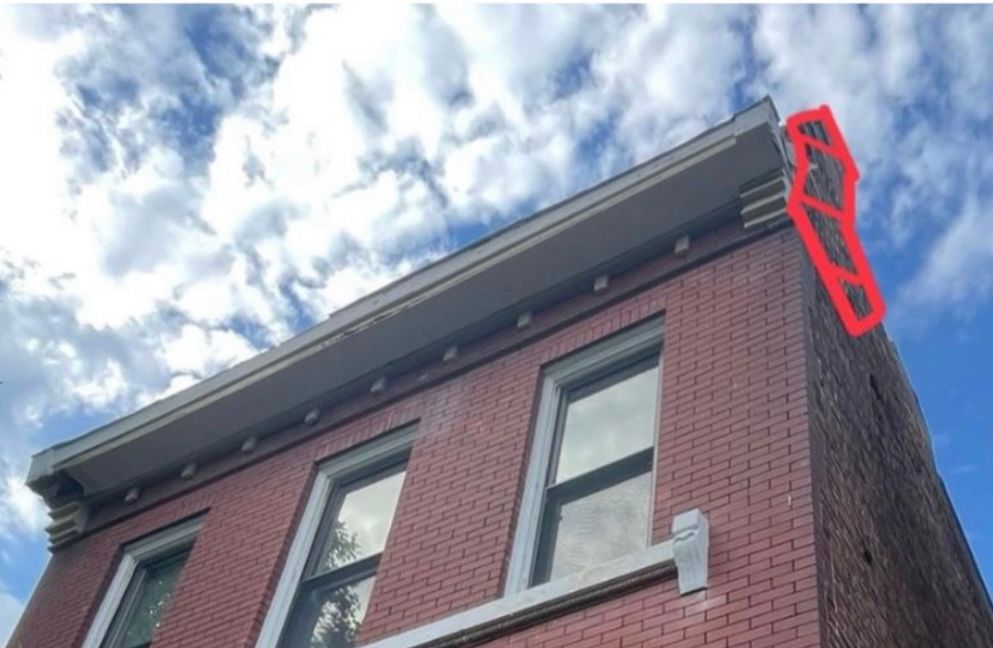 Leaning parapet wall that had to be rebuilt