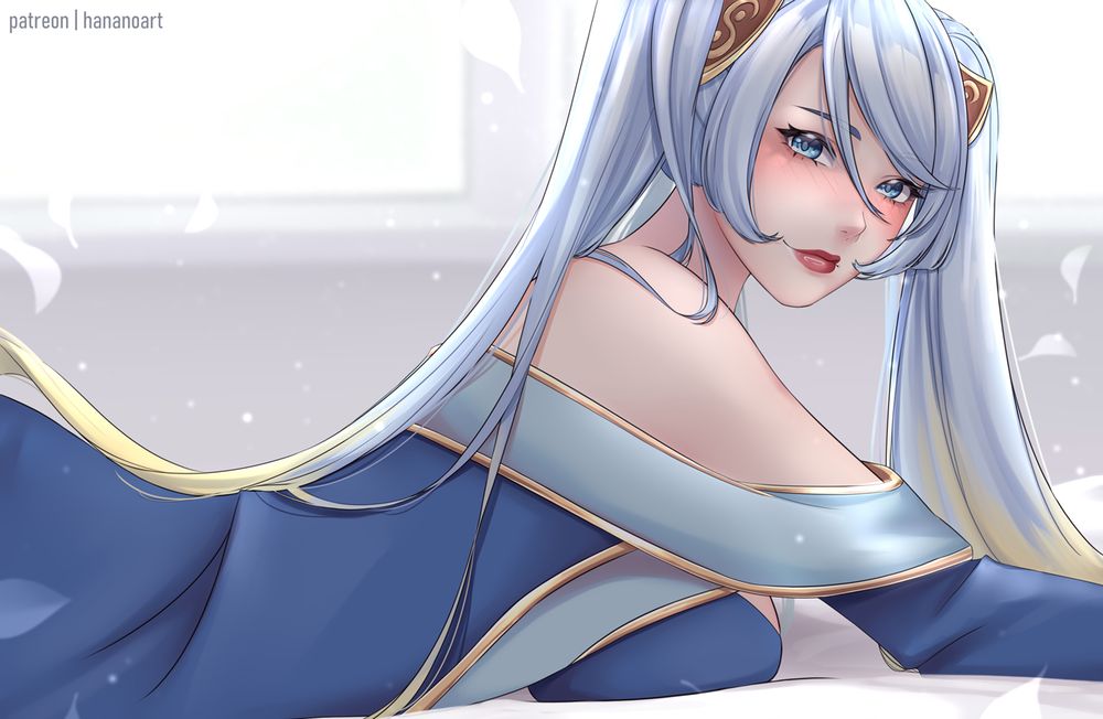 Sona from League of Legends, she's laying with her belly down and there's an angelic aura around her