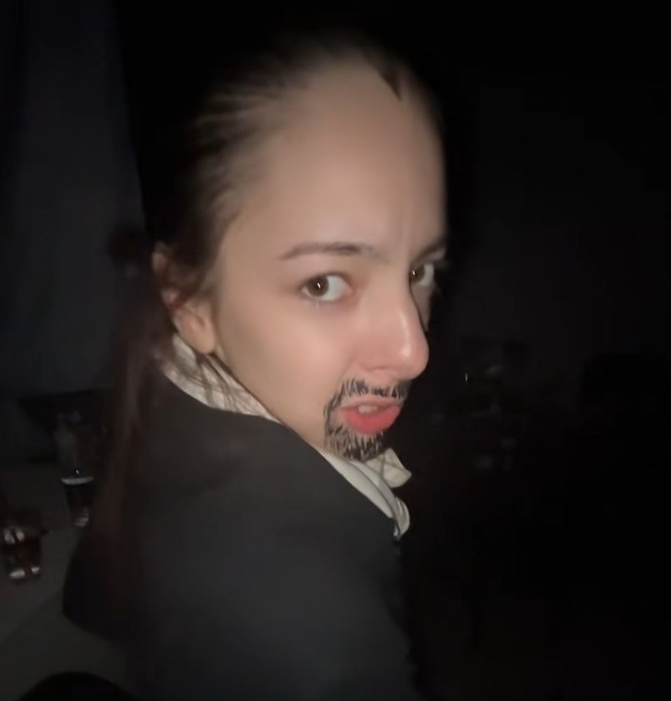 a woman dressed up as Alexander Hamilton from the play, Hamilton 