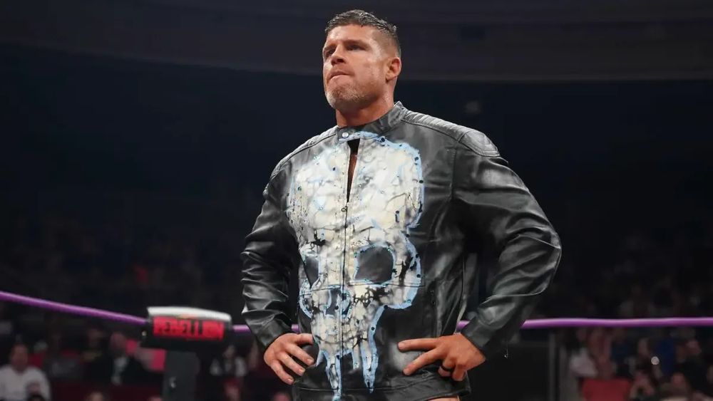 Picture of Steve Maclin wearing a Punisher style jacket, looking disappointed.