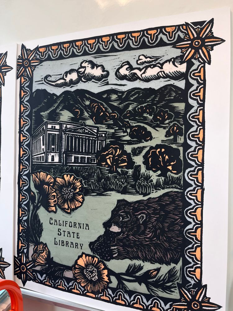 Poster of an original block print by Patricia Wakida. Featuring the text “California State Library”. In the left center of the print is the front facade of the Historic Library and Courts building in Sacramento that houses some sections of the State Library. The building is set in a field of oak trees and has an artistic frame with poppies. There is also a California grizzly bear, eating grapes in the bottom right corner of the print, which represents a very unique depiction of the state animal available for viewing only in the historic library building. 
